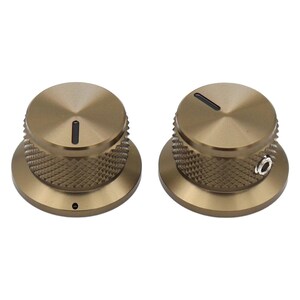 May include: Two circular bronze-colored control knobs with a knurled side texture and a flat top surface. Each knob features a single black indicator line on the top and a small silver-colored set screw on the side for secure attachment.