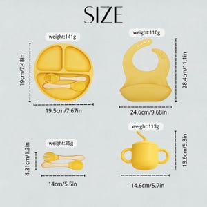 May include: Yellow baby feeding set including a divided plate with utensils, a bib, and a sippy cup with a straw. The plate is 7.67 inches wide, the bib is 11.1 inches long, and the cup is 5.7 inches wide.