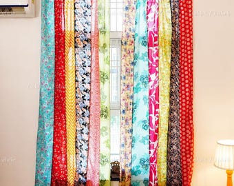 May include: A set of floor-length curtains featuring vertical panels of various fabrics in vibrant colors including turquoise, red, yellow, pink, and black. Each panel displays distinct floral, geometric, and abstract patterns.