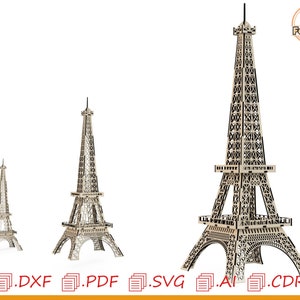 May include: Three different sizes of Eiffel Tower models made of wood. The models are detailed and intricate, with a light brown color. The largest model is about 12 inches tall, the medium model is about 6 inches tall, and the smallest model is about 3 inches tall.