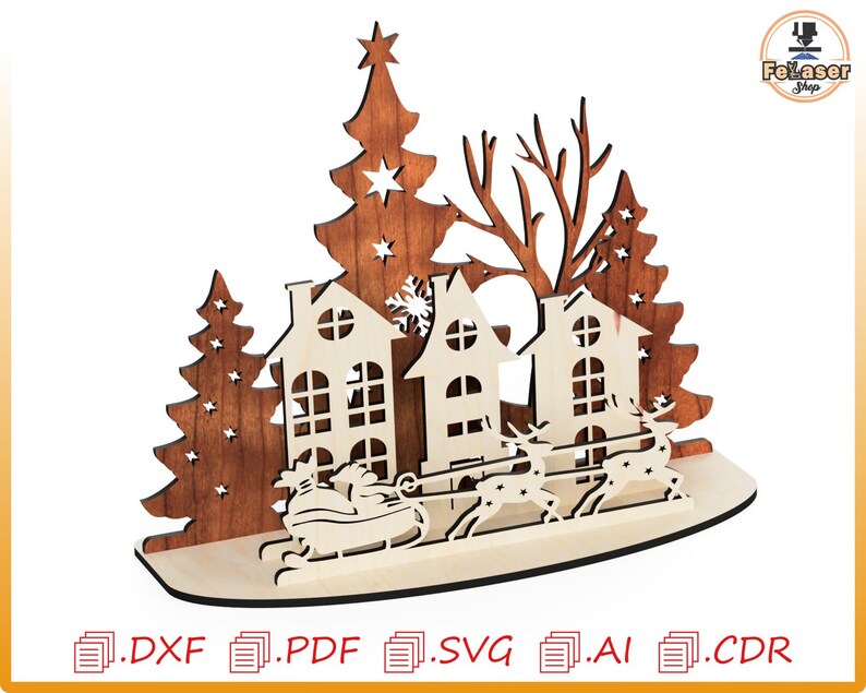 May include: A laser cut wooden Christmas scene with three houses, two Christmas trees, and a sleigh pulled by reindeer. The houses are decorated with windows and a chimney. The trees are decorated with stars. The sleigh is filled with presents.