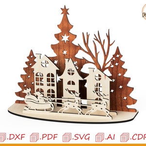 May include: Laser cut wooden Christmas scene with three houses, a Christmas tree, and a sleigh pulled by reindeer. The houses are white with brown trim and windows. The Christmas tree is brown with stars cut out. The sleigh is brown with a white base. The reindeer are brown with antlers.