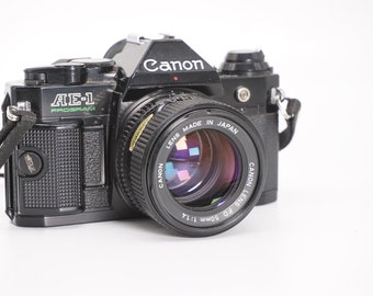 Canon AE-1 Programme Noir 35mm SLR vintage 35mm Film Camera w / Canon FDn 50 mm f/1.4 | Entièrement fonctionnel