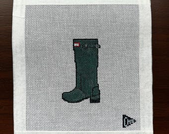 May include: A green rubber rain boot with a red logo and a white canvas background. The canvas has a grid pattern and the text "Chas Hill Studio" is in the bottom right corner.