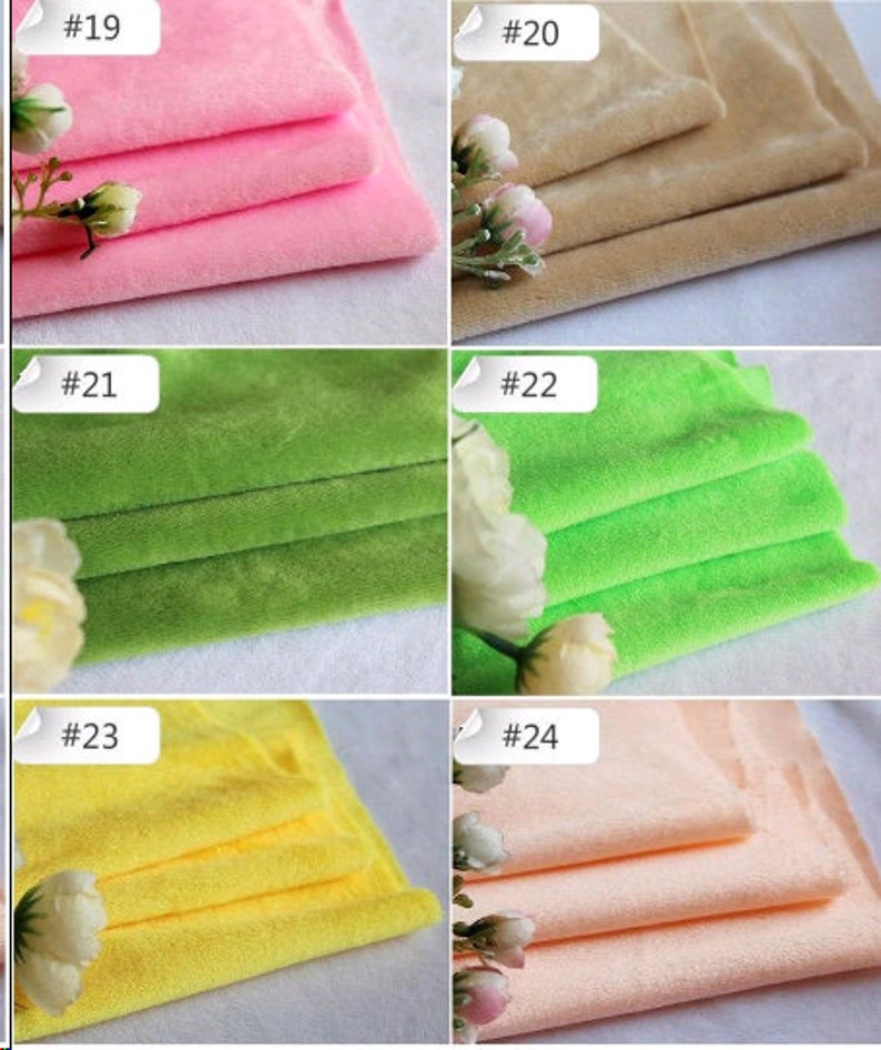 May include: Six fabric swatches in different colors, including pink, beige, green, yellow, and peach. Each swatch is folded in thirds and labeled with a number from 19 to 24.