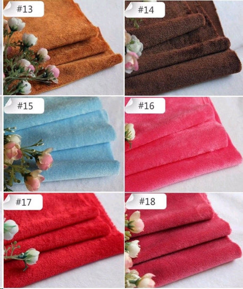 May include: Five different colors of soft, plush fabric swatches. The colors are brown, dark brown, light blue, pink, and red.