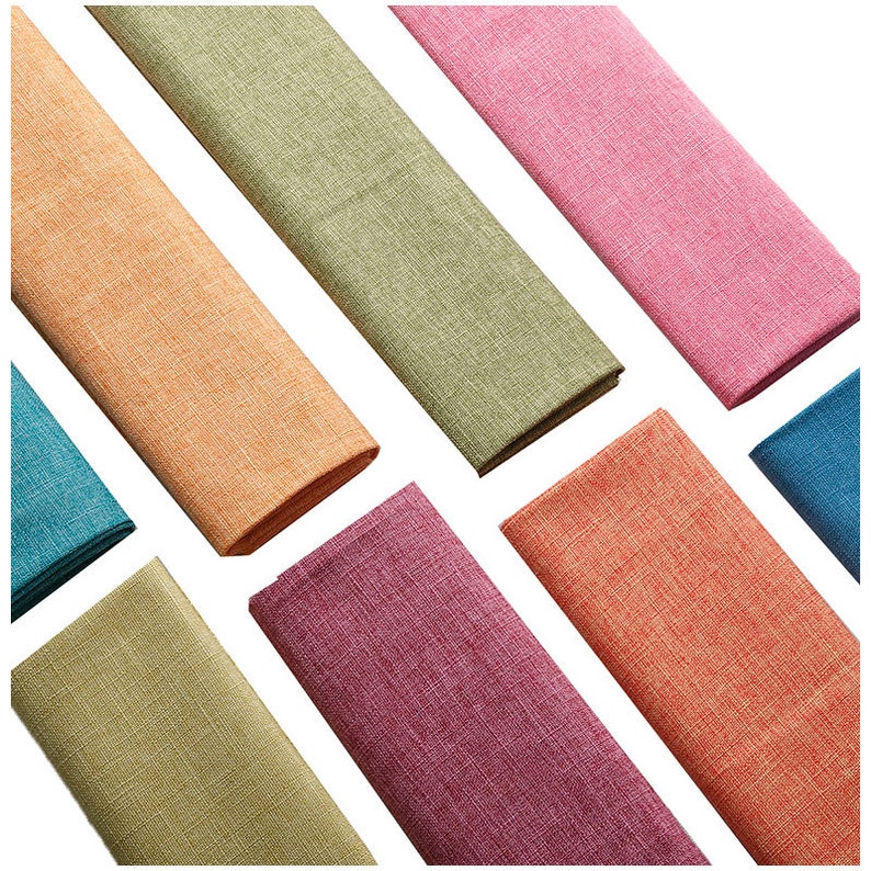 May include: Eight fabric swatches in various colors, including teal, orange, green, pink, and red. The swatches are arranged in a fan shape on a white background.