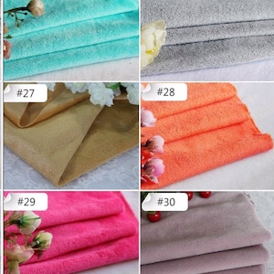 May include: A collection of ten fabric swatches in various colors, including turquoise, gray, beige, orange, pink, and purple. Each swatch is labeled with a number from 25 to 30.
