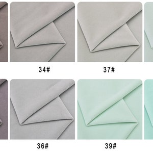 May include: Eight fabric swatches in various shades of gray and green. The swatches are folded in half and labeled with numbers 33 through 40.