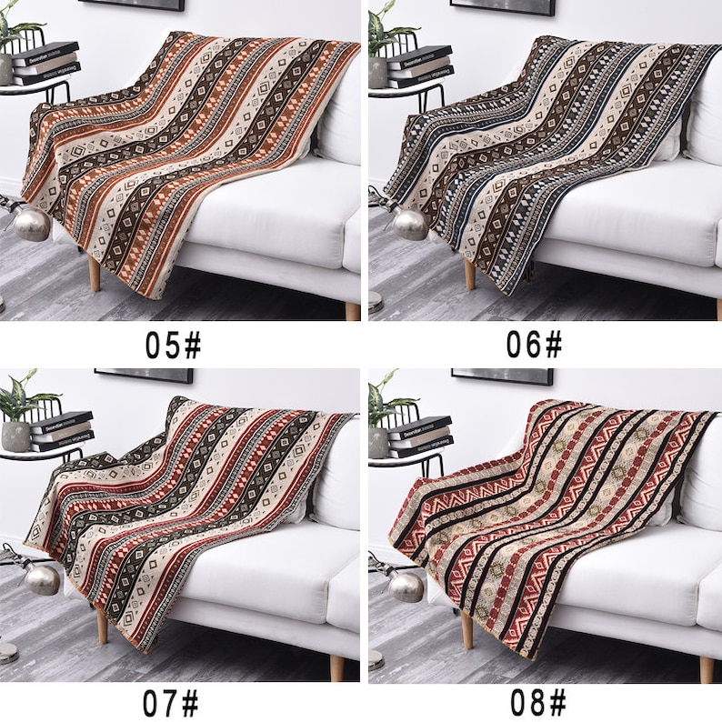 May include: Four different patterned throw blankets are displayed on white sofas. The blankets feature a variety of colors, including brown, red, black, and white. The blankets are made of a soft, comfortable fabric and are perfect for adding a touch of style to any room.