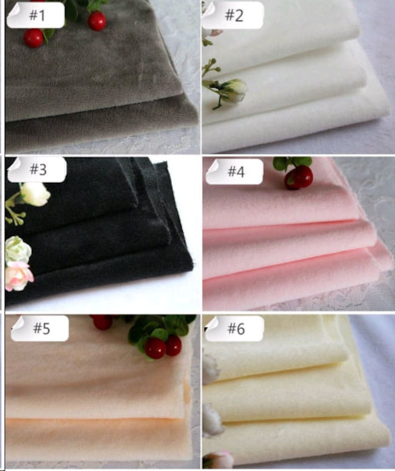 May include: Six different colors of soft, plush fabric swatches. The colors are gray, white, black, pink, peach, and cream.