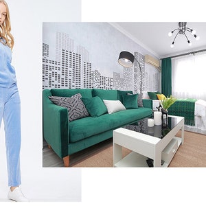 May include: A light blue velour tracksuit with a zippered hoodie. The tracksuit is shown on a white background.