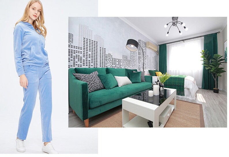 May include: A light blue velour tracksuit with a zippered hoodie. The tracksuit is shown on a white background.