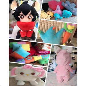 May include: A collection of plush toys, including a cartoon character with black hair and a red scarf, a blue crown-shaped pillow, a pink bunny in a pink onesie, a white and pink plush toy with a bow, and a variety of other colorful plush toys.