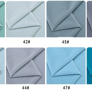May include: Eight fabric swatches in different shades of blue and green. The swatches are labeled with numbers 41 through 48.