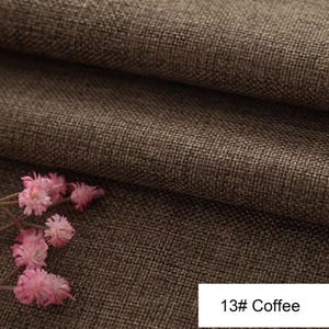 May include: A brown fabric with a visible woven texture, featuring a folded layer and a small cluster of light pink flowers in the corner. A white rectangular label in the bottom right corner displays the text 13# Coffee in black font.
