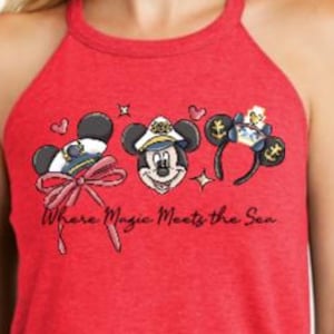 May include: A red sleeveless tank top featuring a graphic print of three Mickey Mouse-themed icons, including a captain's hat with a bow, a captain's face, and nautical ears. The text "Where Magic Meets the Sea" is printed in black script below.