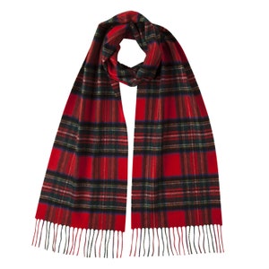 May include: A red and black tartan scarf with fringed ends. The scarf is made of a soft, warm material and is perfect for keeping you warm in the winter.