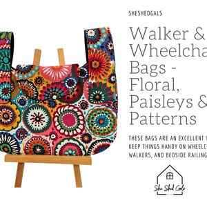 May include: A colorful walker and wheelchair bag with a floral and paisley pattern. The bag is displayed on a small wooden easel. The bag has a variety of colors including red, blue, yellow, and green. Text on the image reads "Walker & Wheelchair Bags - Floral, Paisleys & Patterns."