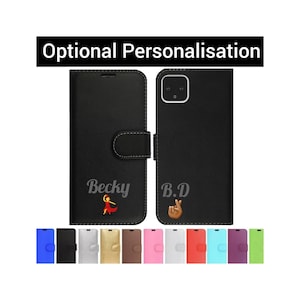 Könnte beinhalten: Schwarzes Leder-Handy-Etui mit Klappverschluss. Das Etui hat ein personalisiertes Design mit dem Namen "Becky" und einem tanzenden Frau-Emoji auf der linken Seite und den Initialen "B.D" und einem Handgesten-Emoji auf der rechten Seite. Das Etui wird in verschiedenen Farben gezeigt.