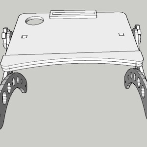May include: A white wooden laptop stand with two black metal adjustable legs. The stand has a cutout for a cup or a phone and a small rectangular slot for a pen or pencil.