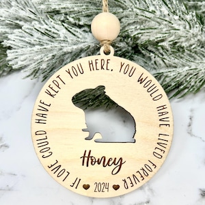 May include: A wooden Christmas ornament with a cutout of a hamster and the text "If love could have kept you here, you would have lived forever. Honey 2024".