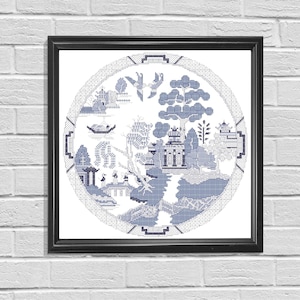 May include: A blue and white circular design featuring a traditional Chinese landscape scene. The design includes a pagoda, trees, a bridge, and a boat. The design is framed in a black frame.
