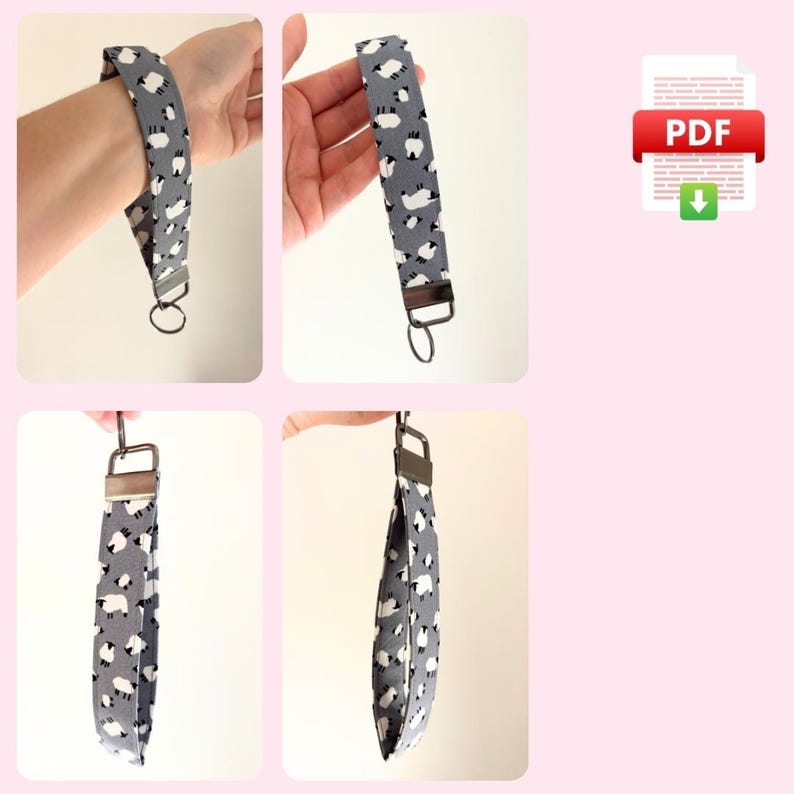 May include: A gray and white fabric key chain with a sheep pattern. The key chain has a silver metal ring.