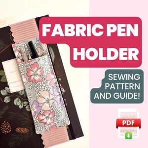 May include: A sewing pattern and guide for making a fabric pen holder. The holder is made of a light blue fabric with a floral pattern and is attached to a notebook. The pattern is available as a PDF download.