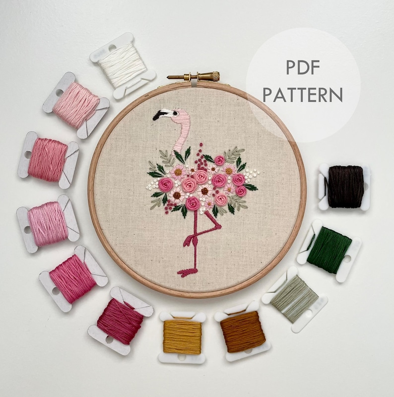 May include: Embroidery pattern for a flamingo with floral accents. The pattern includes 11 different colored embroidery floss spools.