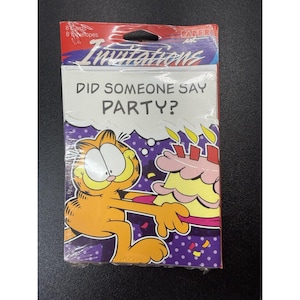 May include: A package of Garfield party invitations. The package includes 8 cards and 8 envelopes. The front of the package features Garfield holding a birthday cake with the text "DID SOMEONE SAY PARTY?"