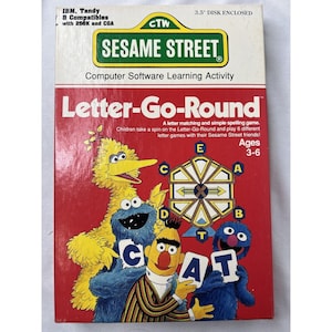 May include: A red box with a Sesame Street theme. The box features a game called "Letter-Go-Round" and includes a 3.5 inch disk. The game is designed for children ages 3-6. The box features images of Big Bird, Cookie Monster, and Elmo.