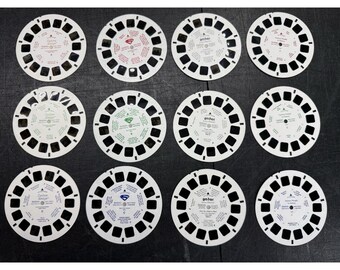 Lote de 4 juegos de 3 carretes View-Master de Jorge el Curioso, Superman, Harry Potter, Famosos