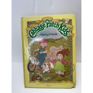 May include: A vintage "Cabbage Patch Kids Making Friends" storybook. The cover features illustrations of children, a dog, and a bicycle. The book is a Parker Brothers Story Book.