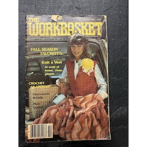 May include: Vintage October 1981 issue of "The Workbasket" magazine. The cover features a woman wearing a knit vest and holding a cup. The magazine promotes fall season favorites, including knitting a vest, crocheting an afghan, and homemade breads.