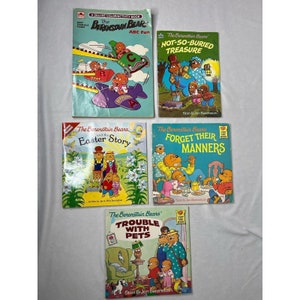 May include: A collection of five Berenstain Bears children's books. The books are all paperback and feature colorful illustrations of the bears. The titles of the books are "The Berenstain Bears ABC Fun", "The Berenstain Bears Not-So-Buried Treasure", "The Berenstain Bears and the Easter Story", "The Berenstain Bears Forget Their Manners", and "The Berenstain Bears' Trouble With Pets".