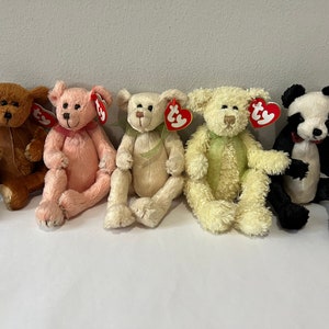 May include: Five plush toys, including a brown dog, a pink bear, a cream bear, a light green bear, and a black and white panda bear. Each toy has a red Ty tag attached.