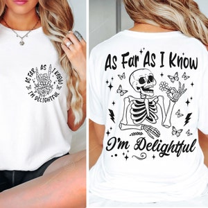 May include: White t-shirt with a black and white graphic of a skeleton with the text "As Far As I Know I'm Delightful" on the back. The front of the shirt has a smaller version of the graphic with the text "As Far As I Know I'm Delightful" in a circle.