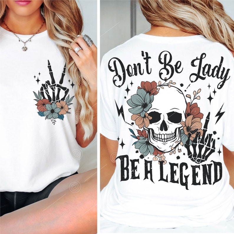 May include: White t-shirt with a skull and flowers graphic and the text "Don't Be Lady Be A Legend".