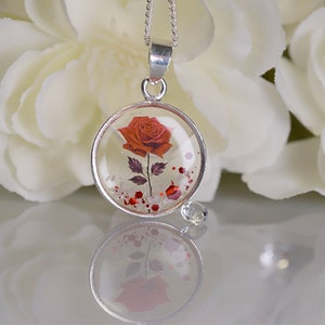 Crematie as en herdenkingsketting met open achterkant roos