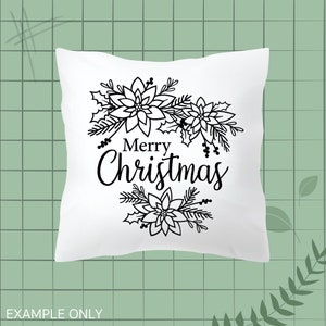 May include: White pillow with a black outline of poinsettia flowers and the text "Merry Christmas".