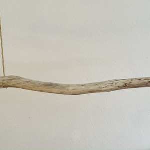 Autumn decorative rod made of driftwood, hanging decoration for Christmas