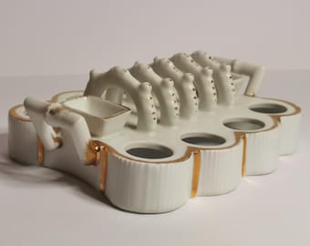 18th Century German white and gilt porcelain toast rack with integrated butter dish