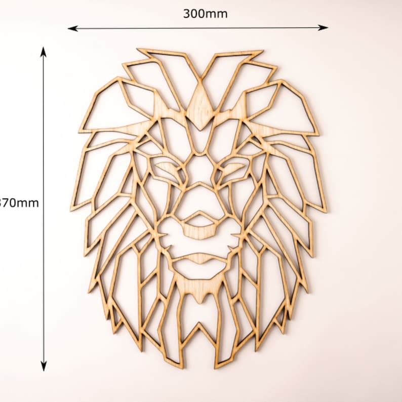 May include: Geometric wooden lion head wall art, measuring 12 inches by 12 inches. The lion's mane and face are made up of intricate geometric shapes.