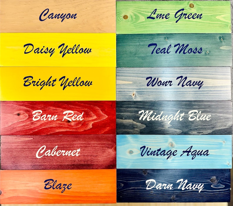 May include: A wood sample board with 12 different wood stain colors. The colors are Canyon, Lime Green, Daisy Yellow, Teal Moss, Bright Yellow, Worn Navy, Barn Red, Midnight Blue, Cabernet, Vintage Aqua, Blaze, and Darn Navy.