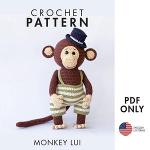 May include: Crochet pattern for a monkey wearing a blue hat and overalls. The pattern is written in English using US terms. PDF download only. "Monkey Lui" is written below the image.