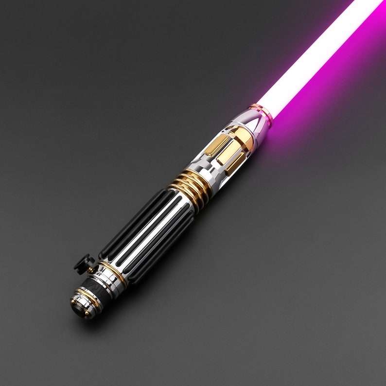 May include: A black and silver lightsaber with a gold accent and a pink blade.