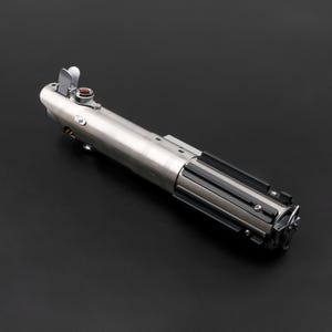 May include: A silver lightsaber with black and silver accents. The hilt features a red button and a silver activation switch. The lightsaber is a replica of a popular science fiction weapon.