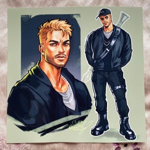 May include: Illustration of a man with short, styled blonde hair and a goatee, wearing a black jacket and a silver chain. The image includes a full-body depiction of the man in black attire, a baseball cap, and a weapon slung over his shoulder.