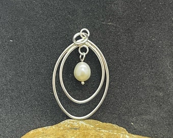 Sterling Silver Egg Shaped with dangling Pearl Charm